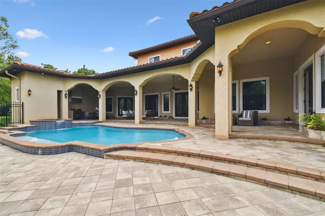 a kitchen with a table and chairs in it