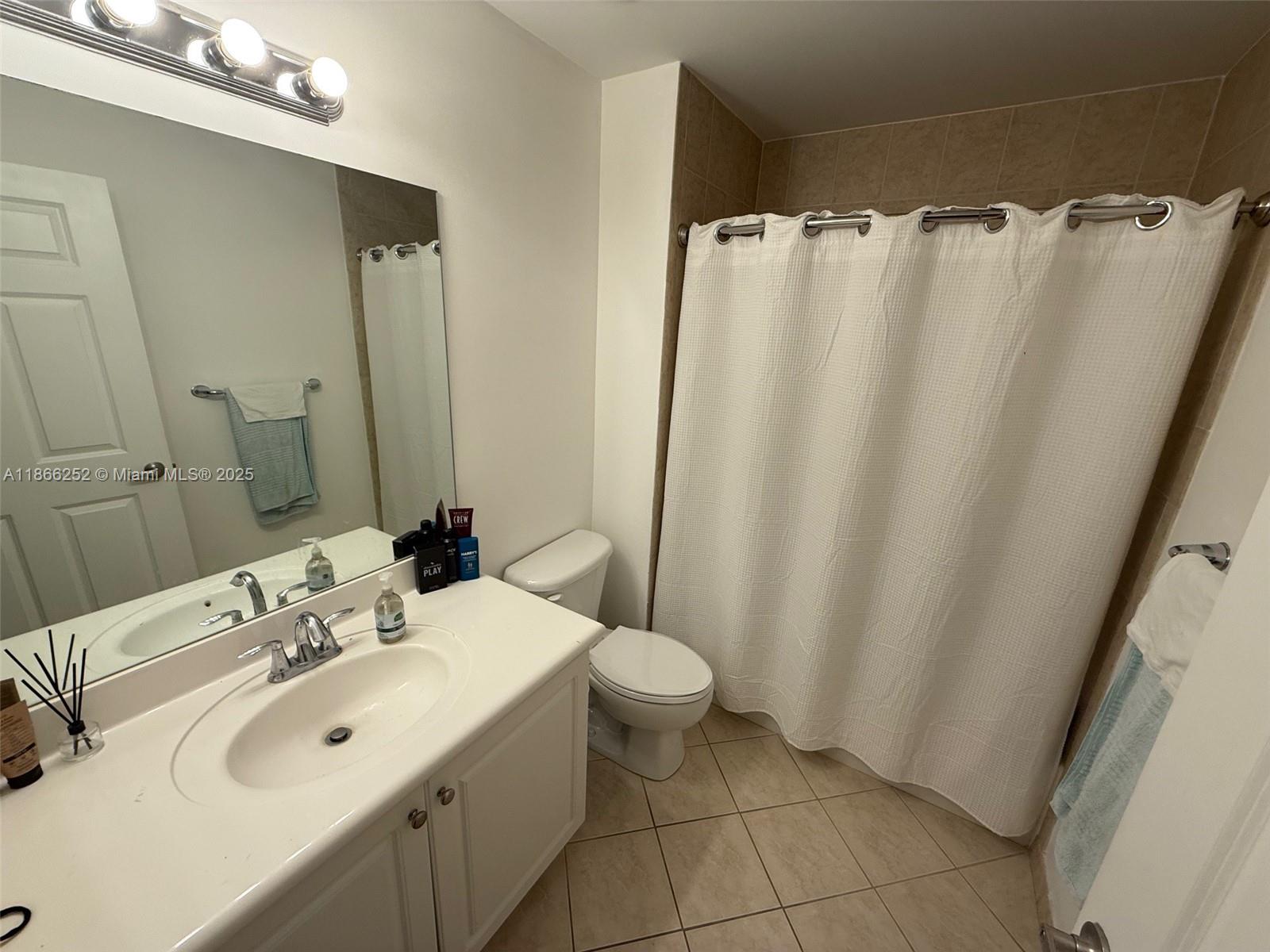 8395 Southwest 73rd Avenue, Unit 509 Miami, FL 33143 - Photo 13 of 41 a bathroom with a sink toilet and shower