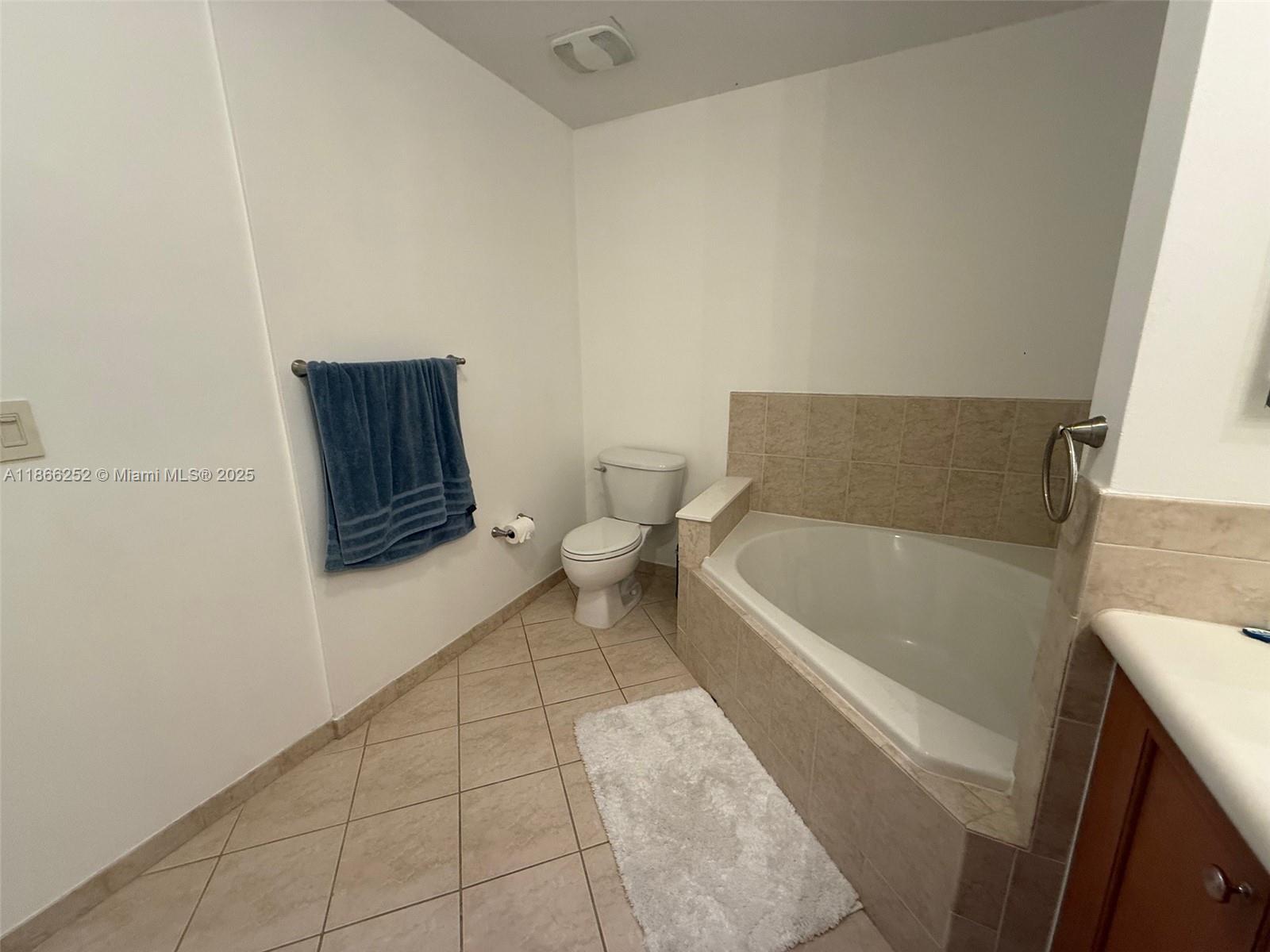 8395 Southwest 73rd Avenue, Unit 509 Miami, FL 33143 - Photo 18 of 41 a bathroom with a tub toilet and sink