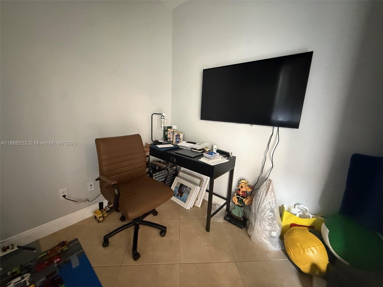 8395 Southwest 73rd Avenue, Unit 509 Miami, FL 33143 - Photo 21 of 41 a view of a workspace with furniture