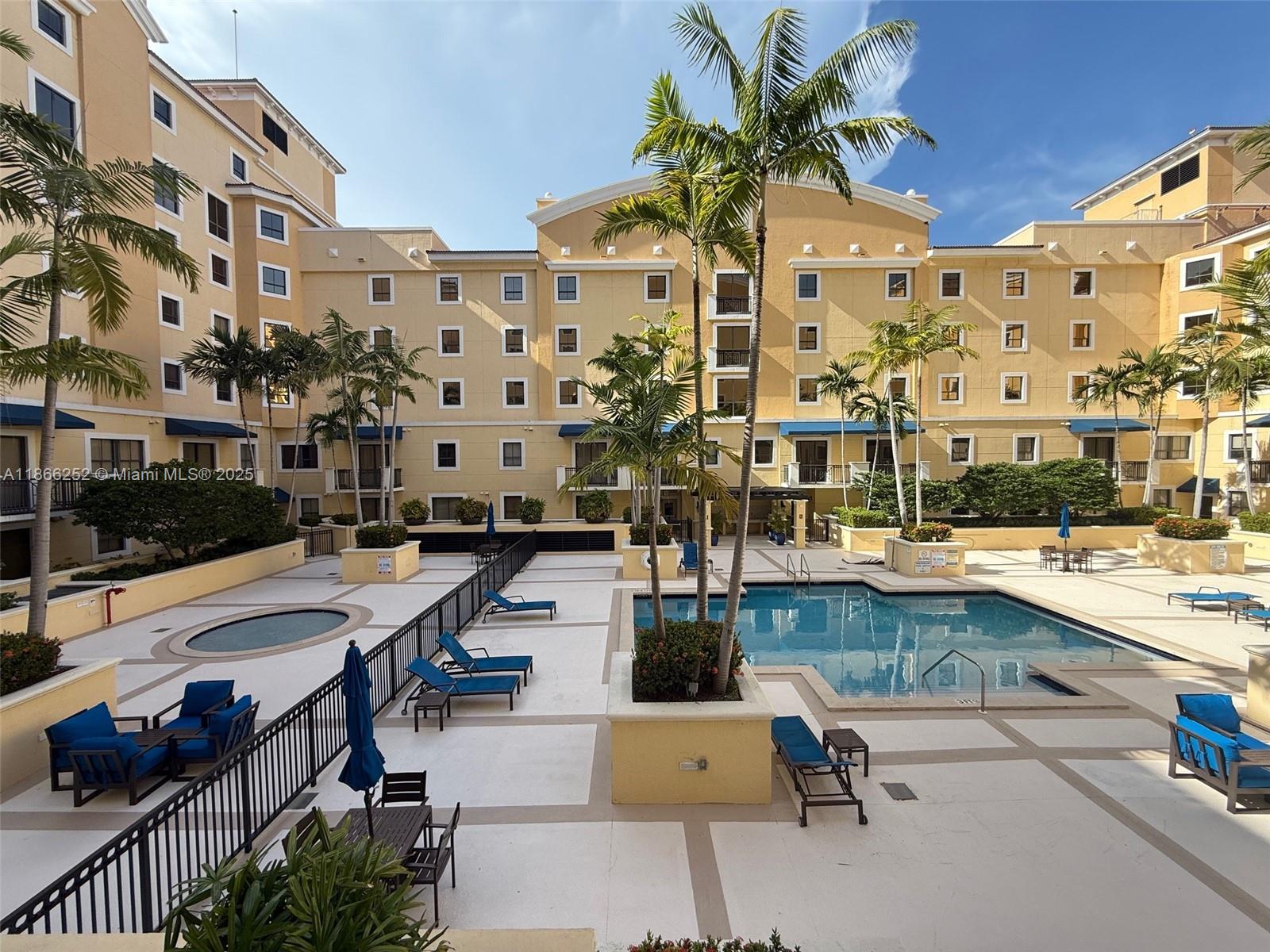 8395 Southwest 73rd Avenue, Unit 509 Miami, FL 33143 - Photo 23 of 41 a view of a patio with swimming pool and furniture