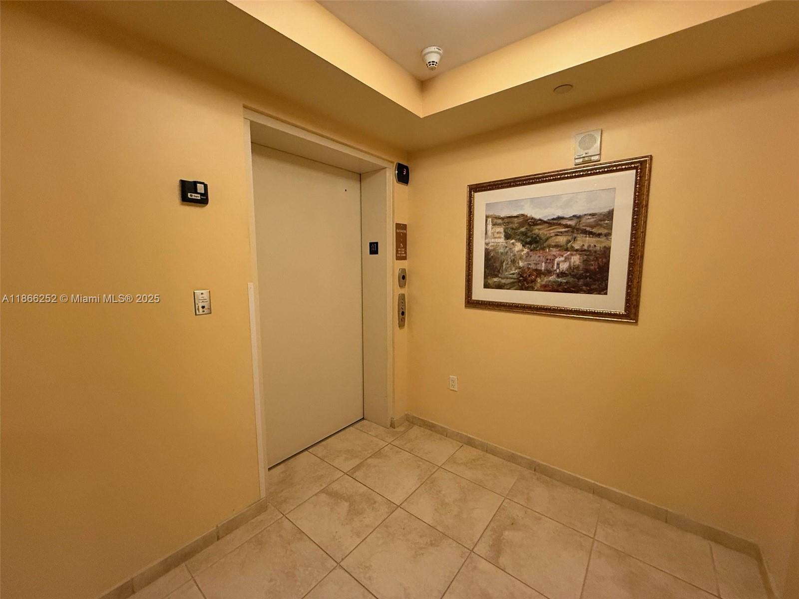 8395 Southwest 73rd Avenue, Unit 509 Miami, FL 33143 - Photo 26 of 41 a view of a hallway with a large window