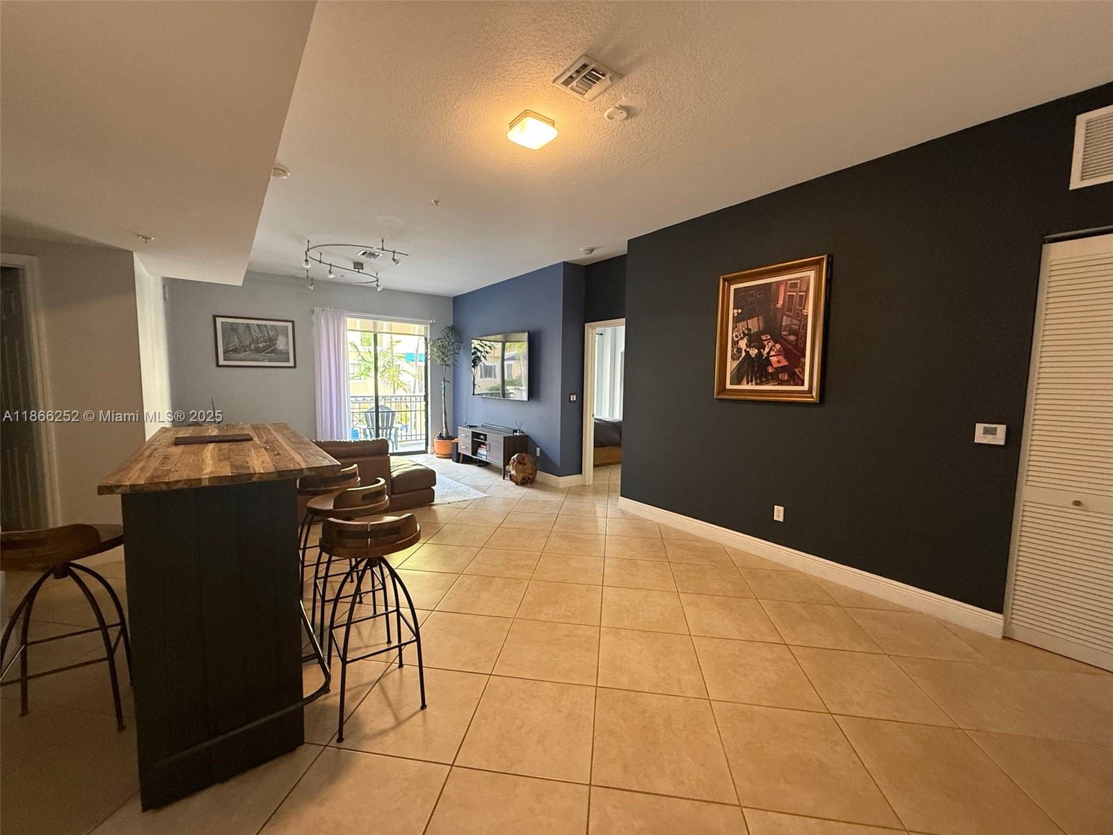 8395 Southwest 73rd Avenue, Unit 509 Miami, FL 33143 - Photo 7 of 41 a view of a livingroom with furniture and window
