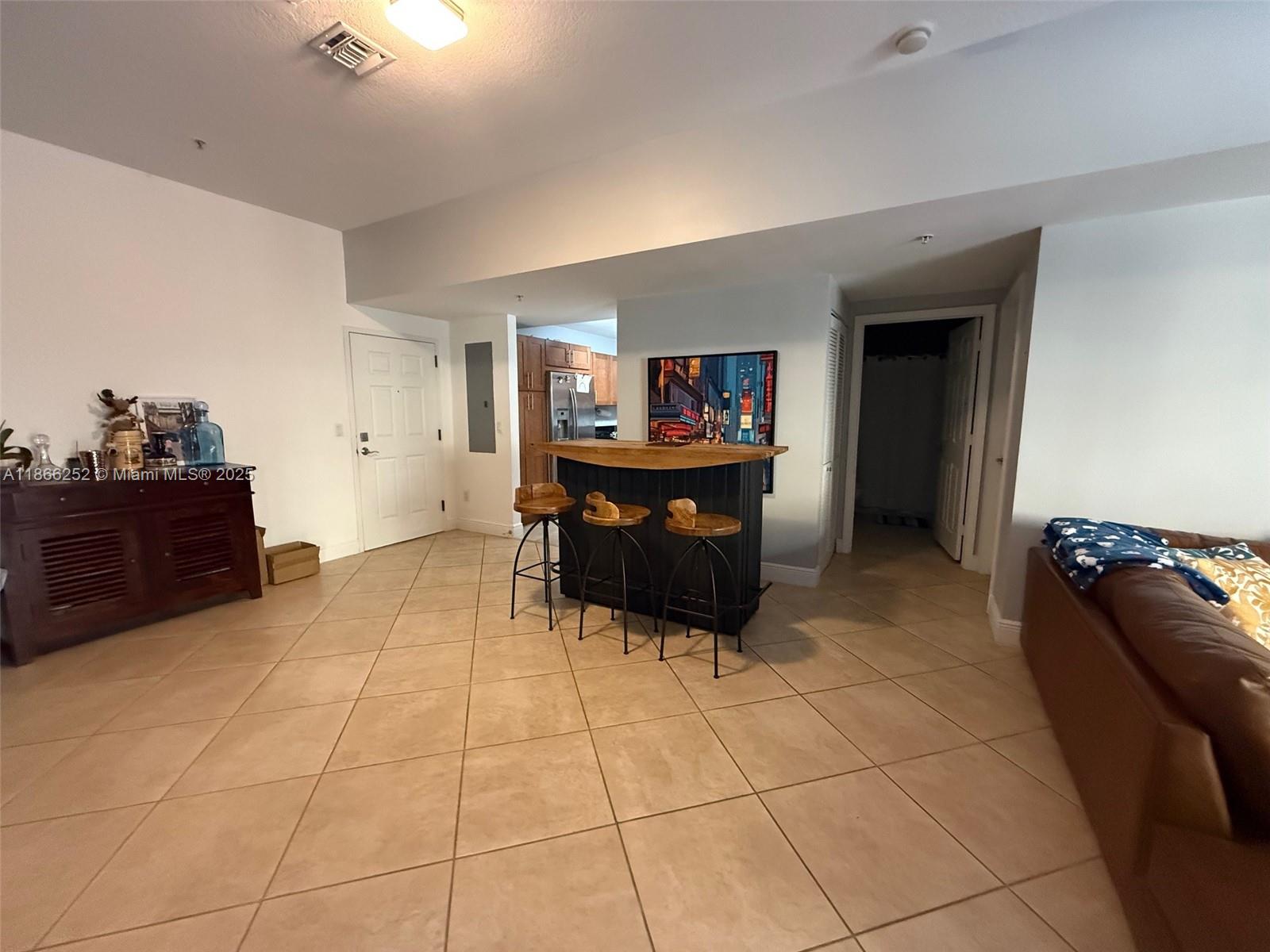 8395 Southwest 73rd Avenue, Unit 509 Miami, FL 33143 - Photo 9 of 41 a living room with furniture and cabinets