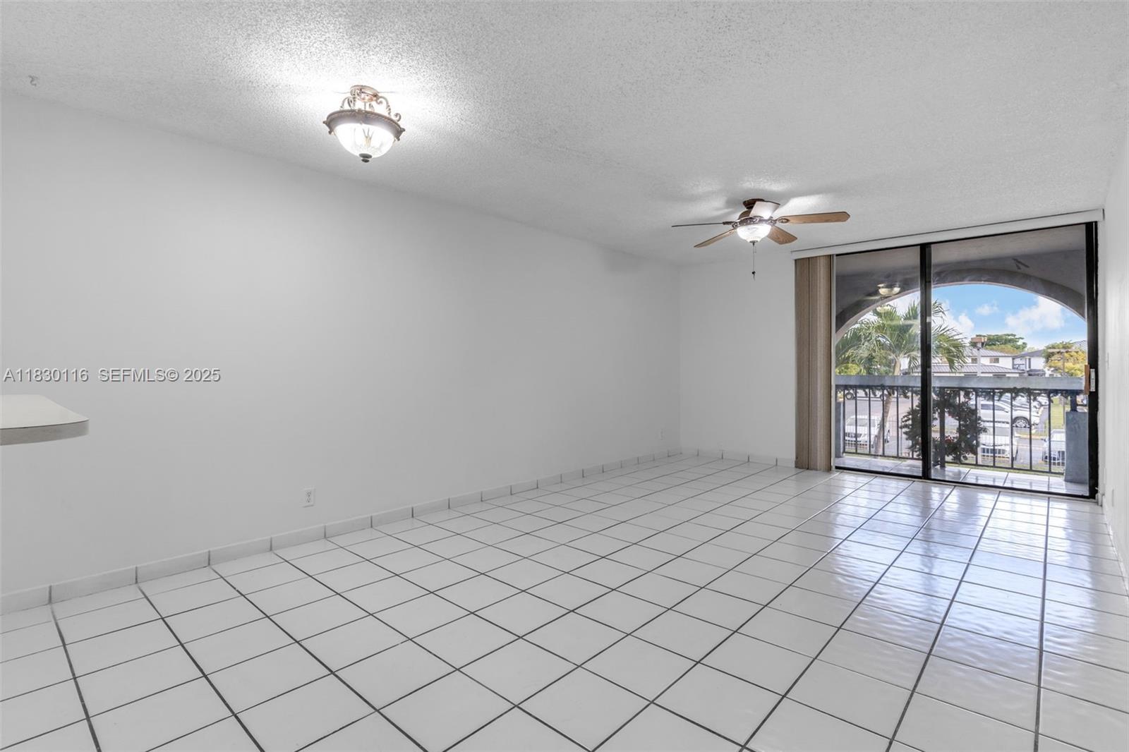 12239 Southwest 14th Lane, Unit 3212 Miami, FL 33184 - Photo 11 of 36 a view of an empty room and window