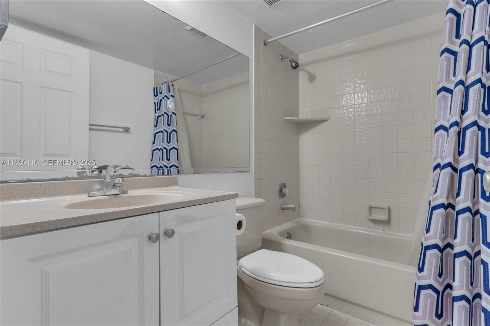 12239 Southwest 14th Lane, Unit 3212 Miami, FL 33184 - Photo 18 of 36 a bathroom with a sink a toilet and a bathtub