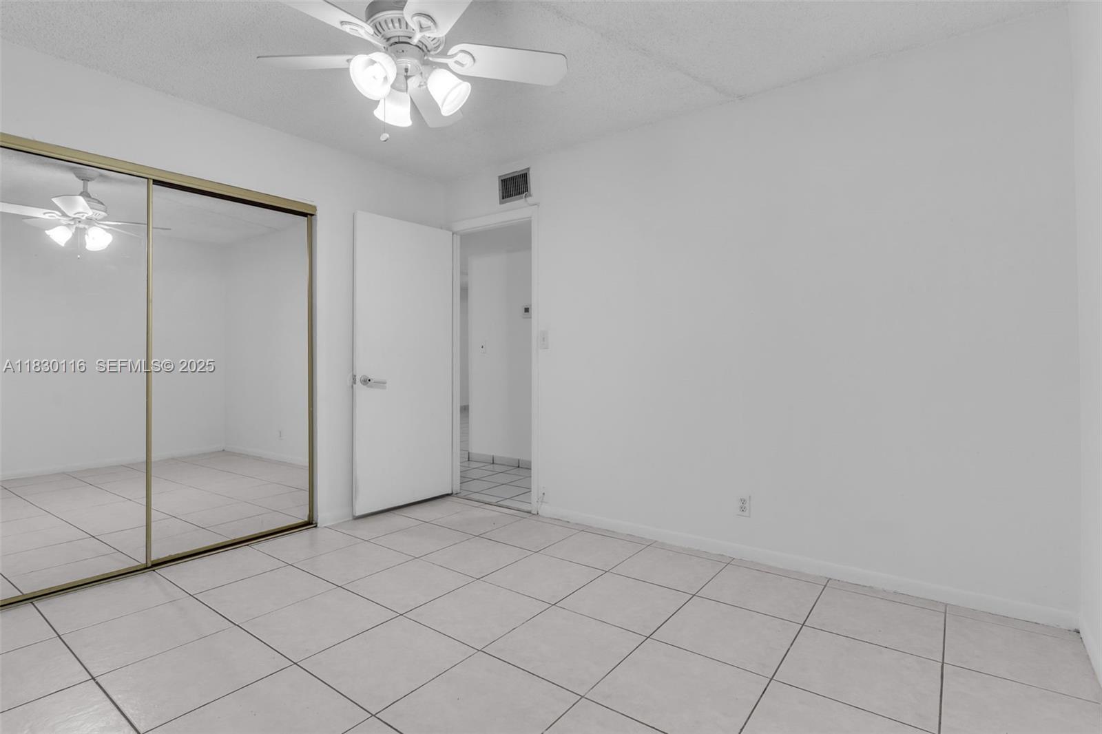 12239 Southwest 14th Lane, Unit 3212 Miami, FL 33184 - Photo 20 of 36 a view of an empty room and window