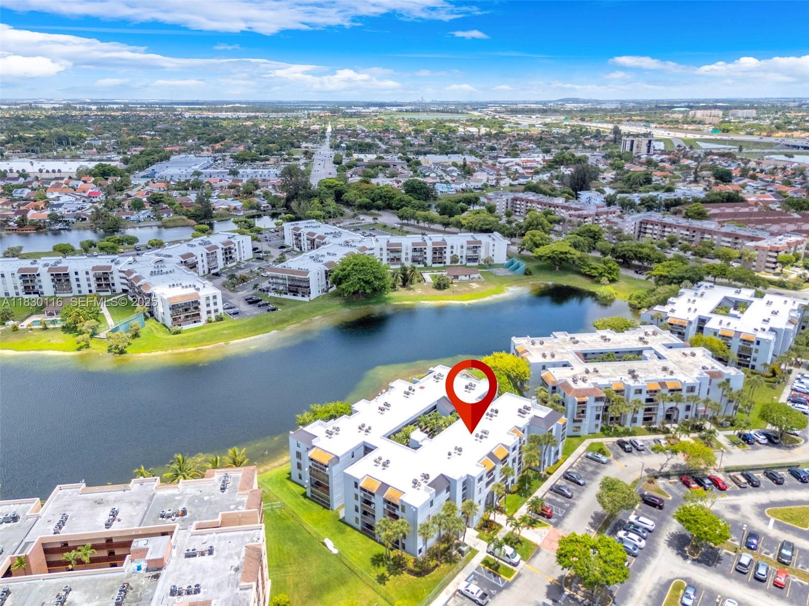 12239 Southwest 14th Lane, Unit 3212 Miami, FL 33184 - Photo 29 of 36 an aerial view of residential houses with outdoor space