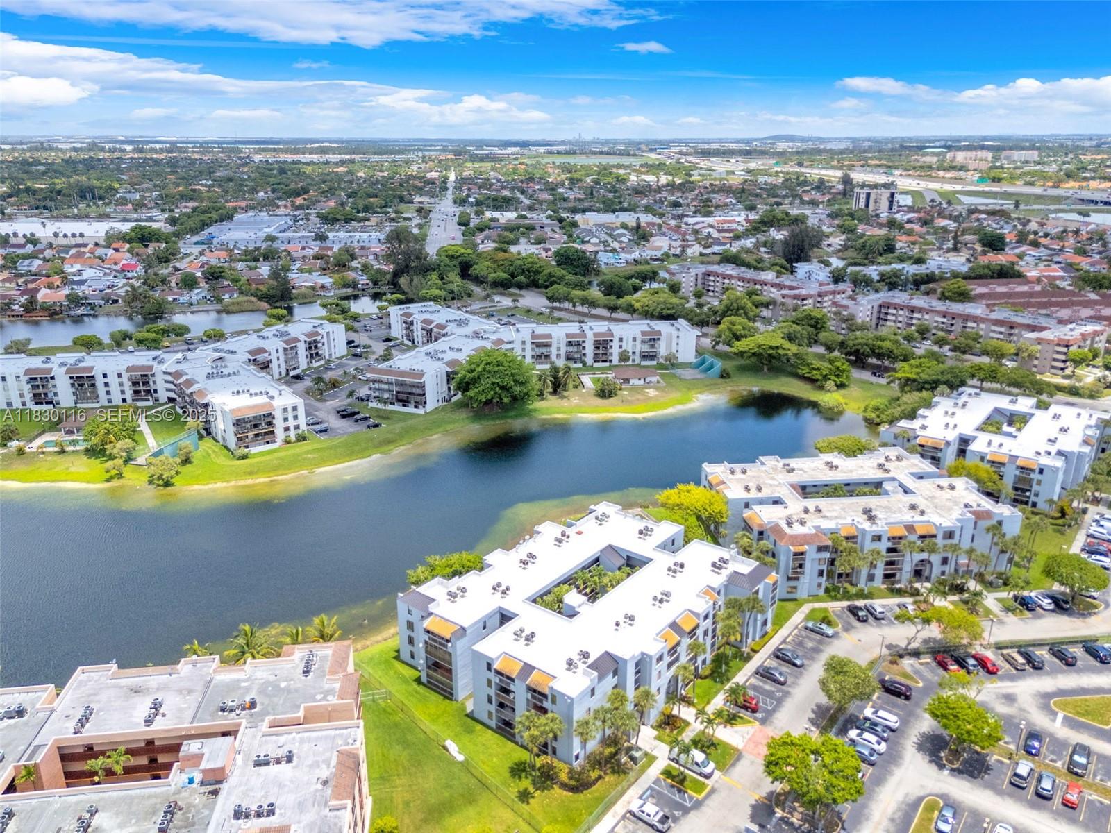 12239 Southwest 14th Lane, Unit 3212 Miami, FL 33184 - Photo 30 of 36 an aerial view of residential houses with outdoor space