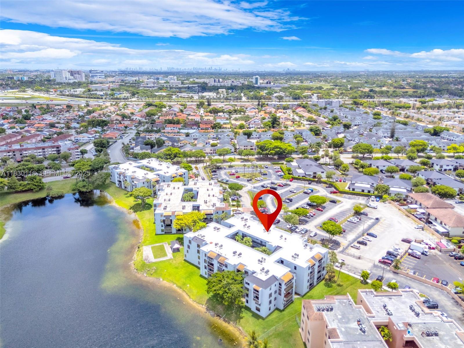 12239 Southwest 14th Lane, Unit 3212 Miami, FL 33184 - Photo 31 of 36 an aerial view of a swimming pool yard an outdoor space and seating