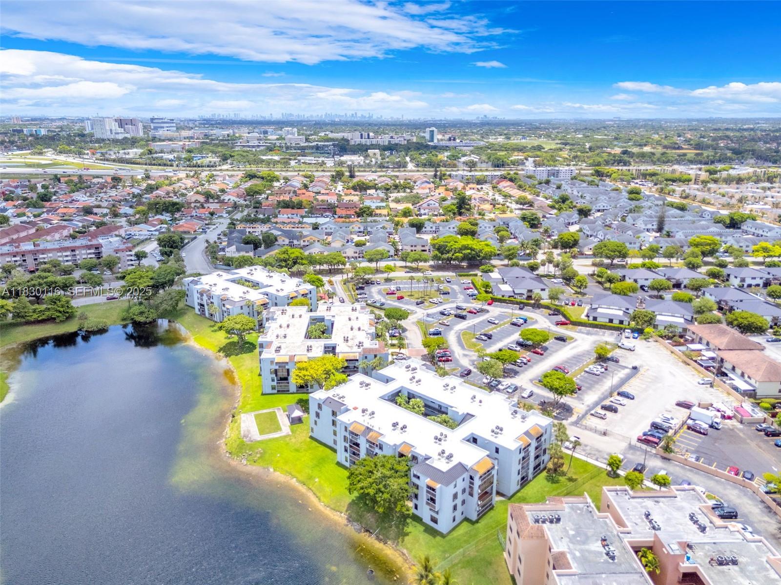 12239 Southwest 14th Lane, Unit 3212 Miami, FL 33184 - Photo 32 of 36 an aerial view of residential houses with outdoor space