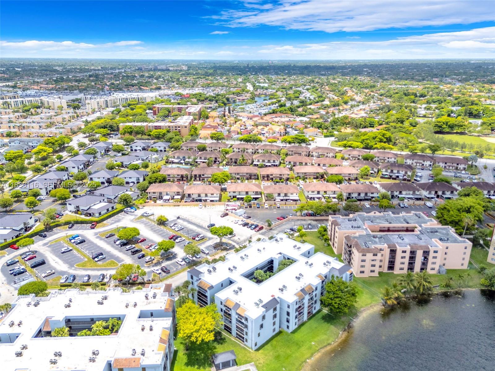 12239 Southwest 14th Lane, Unit 3212 Miami, FL 33184 - Photo 34 of 36 an aerial view of residential houses with outdoor space