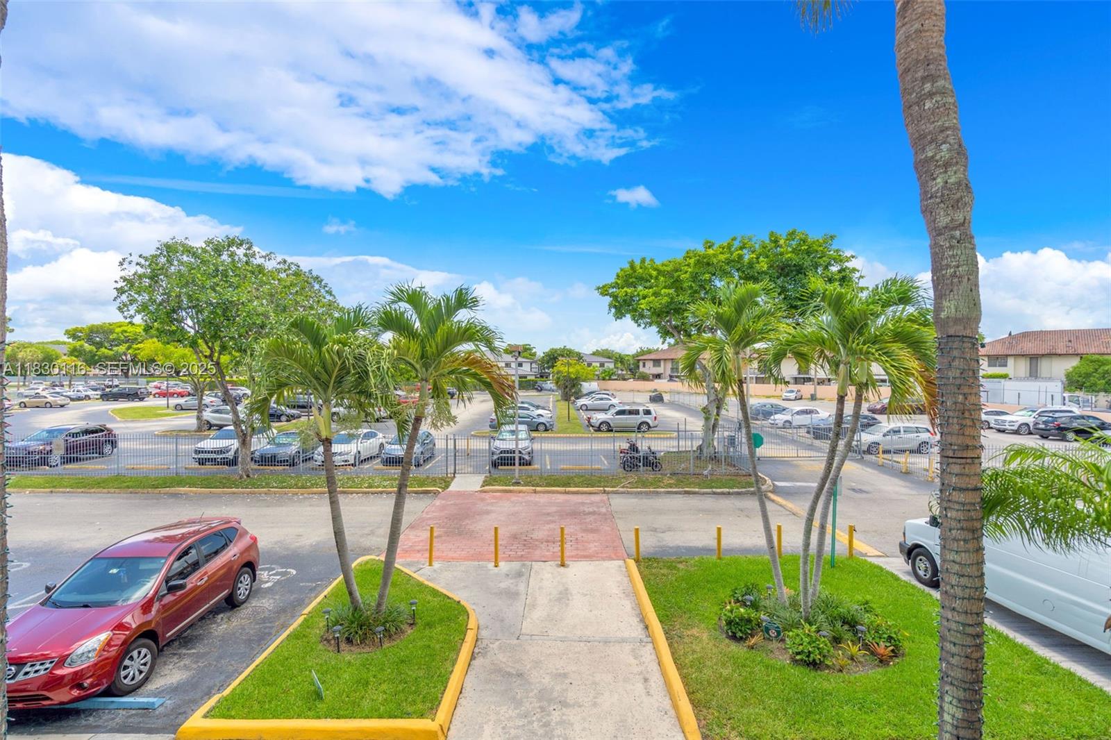 12239 Southwest 14th Lane, Unit 3212 Miami, FL 33184 - Photo 6 of 36 a swimming pool with outdoor seating and yard