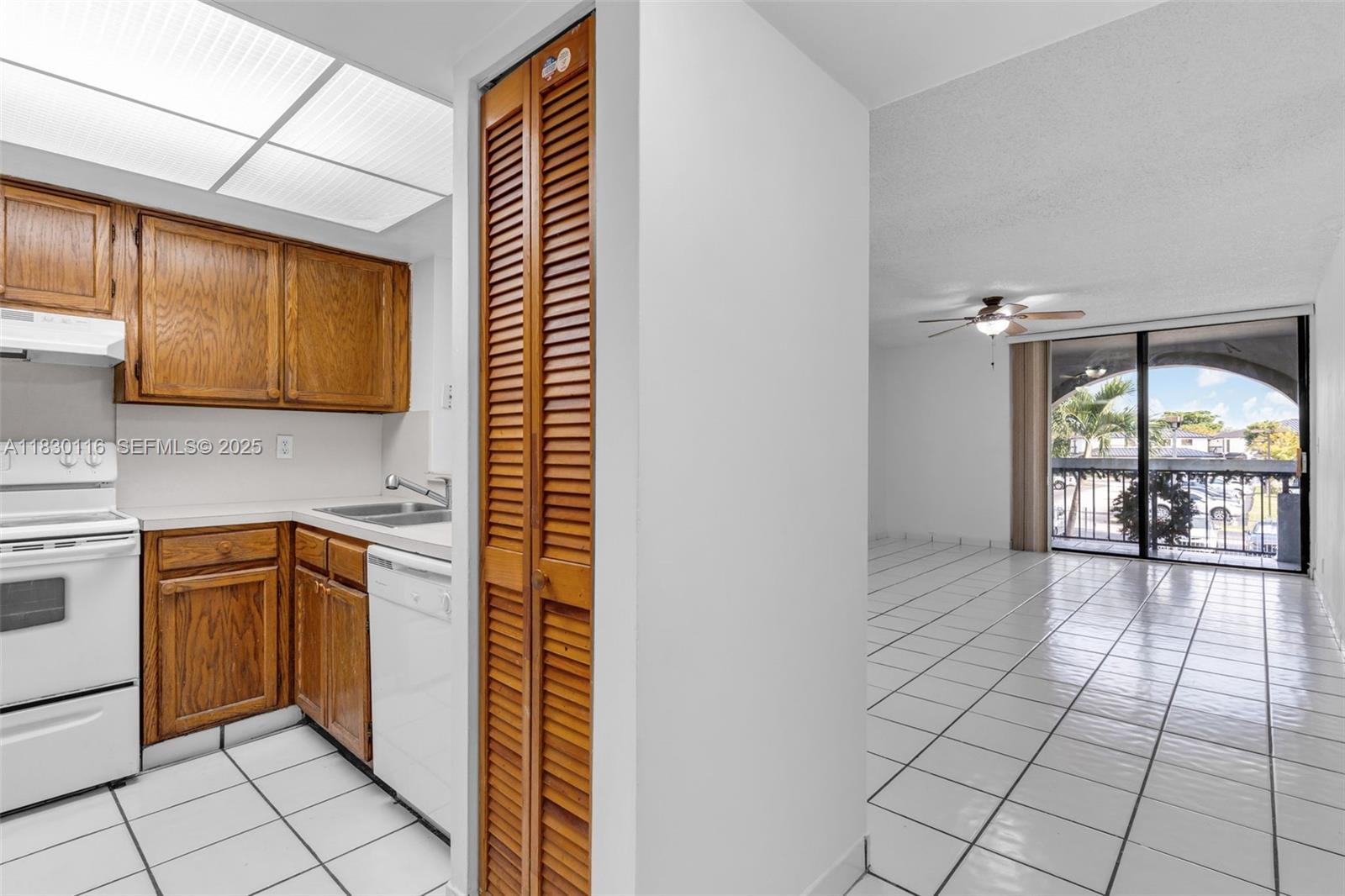12239 Southwest 14th Lane, Unit 3212 Miami, FL 33184 - Photo 7 of 36 a view of a kitchen with windows