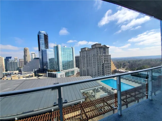 a terrace with outdoor seating and city view
