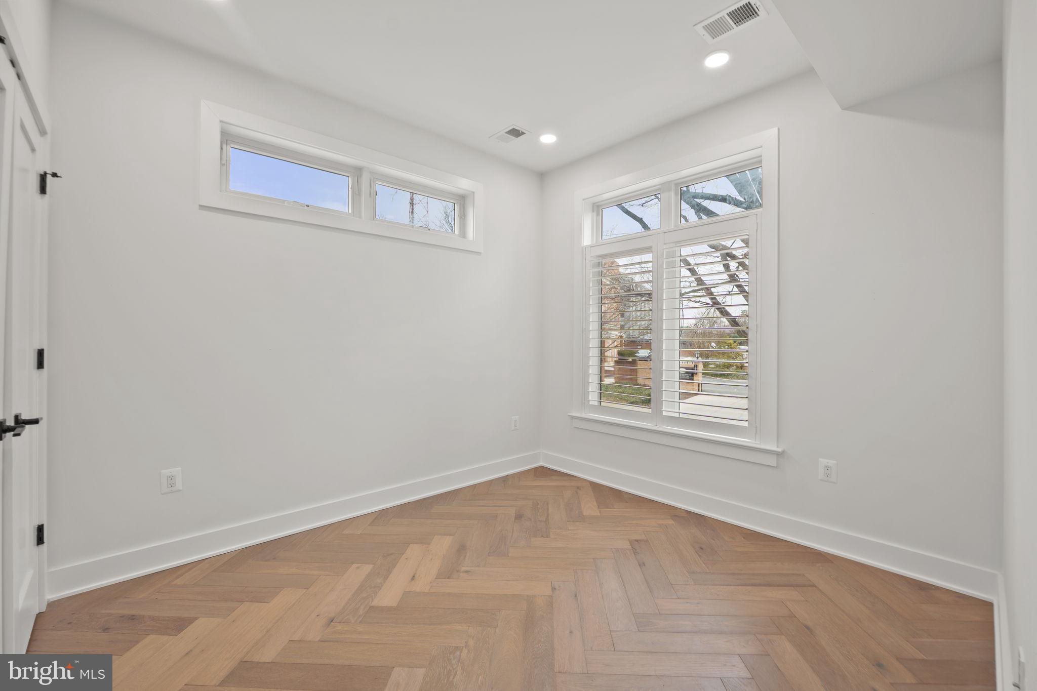 4315 Harrison Street Northwest, Unit 5 Washington, DC 20015 - Photo 18 of 33 an empty room with windows