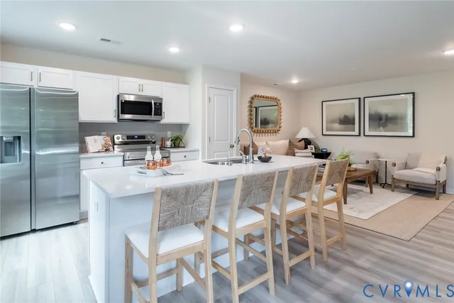 a dining room with furniture a window and kitchen view