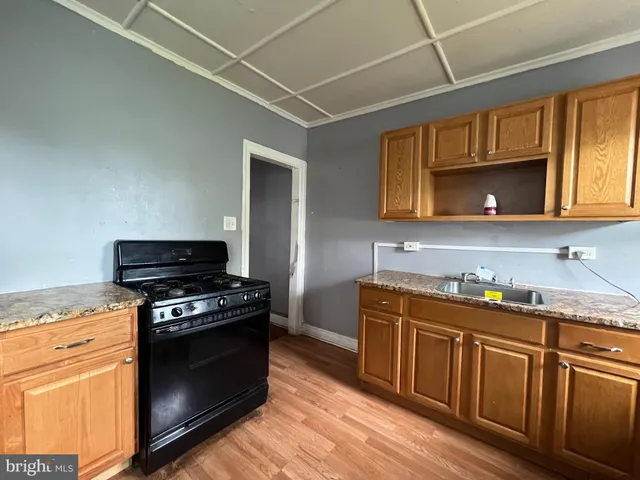a kitchen with stainless steel appliances granite countertop a stove and a microwave