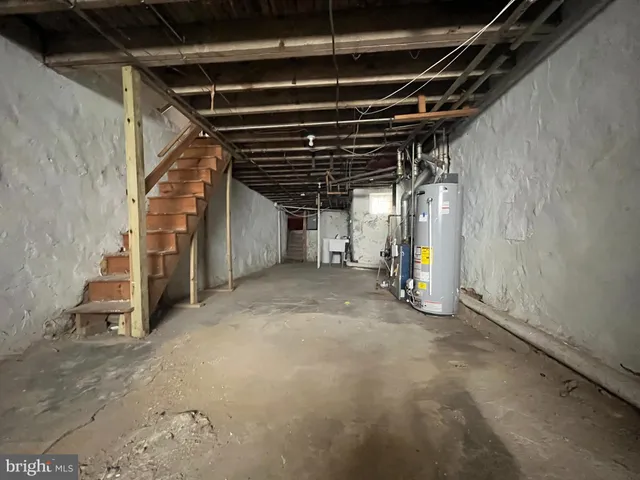 a view of empty room with wooden ceiling