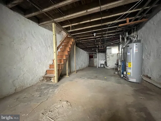 a view of empty room with wooden ceiling