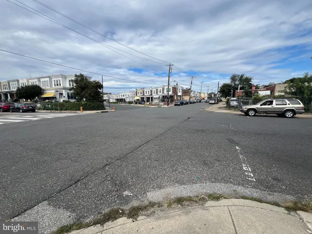 a view of a street with cars