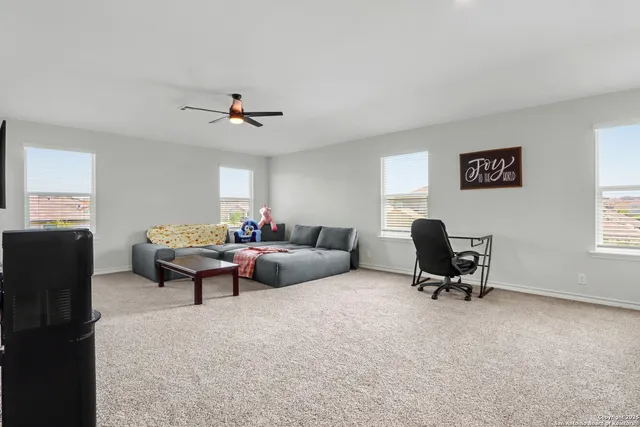 a living room with furniture and a window