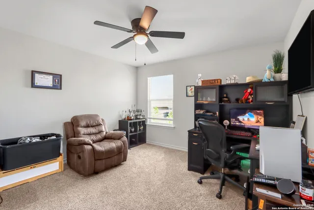 a bathroom with a sink a toilet and a shower curtain