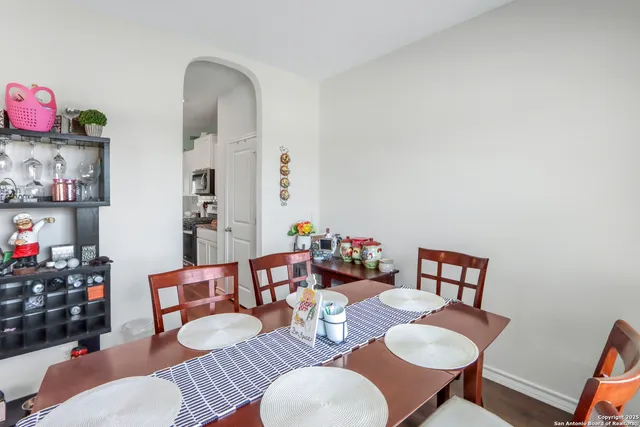 a dining room with furniture and window