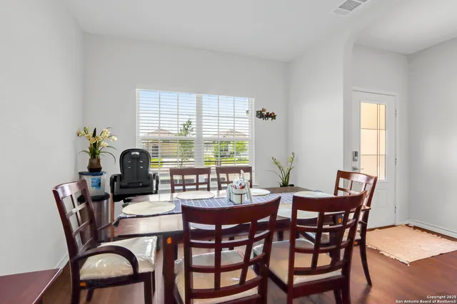 a kitchen with stainless steel appliances granite countertop a stove top oven a sink dishwasher and a refrigerator