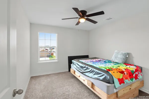 a living room with furniture a table and a window