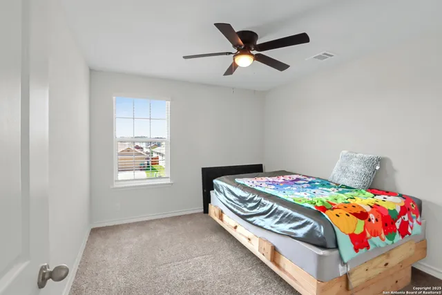 a living room with furniture a table and a window
