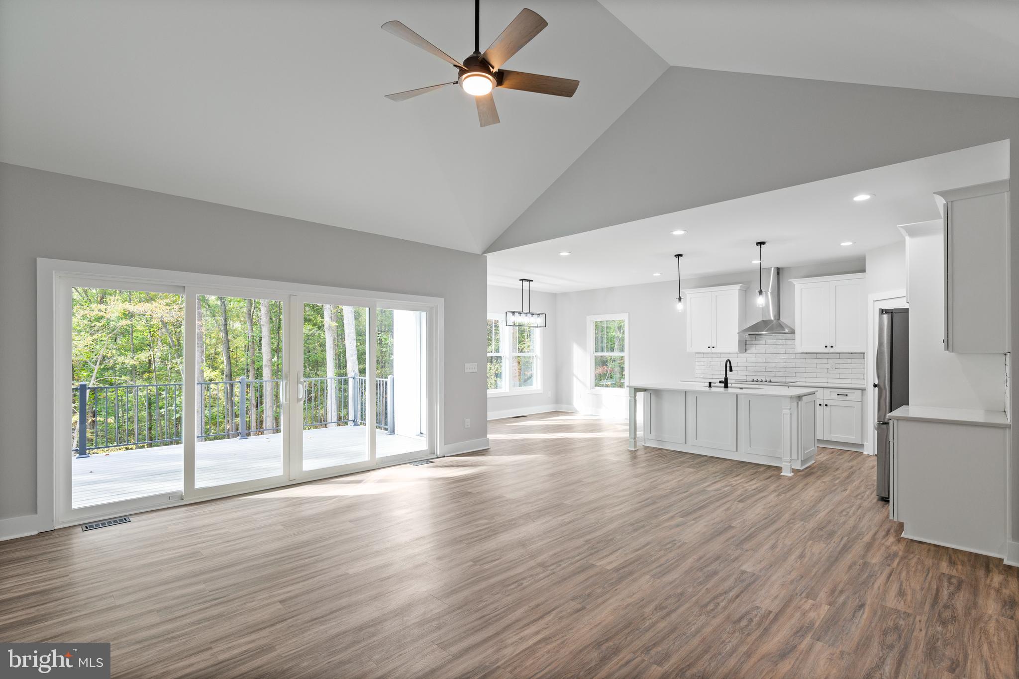 Tbd Lookout Circle Orange, VA 22960 - Photo 14 of 48 a large kitchen with white cabinets and wooden floors
