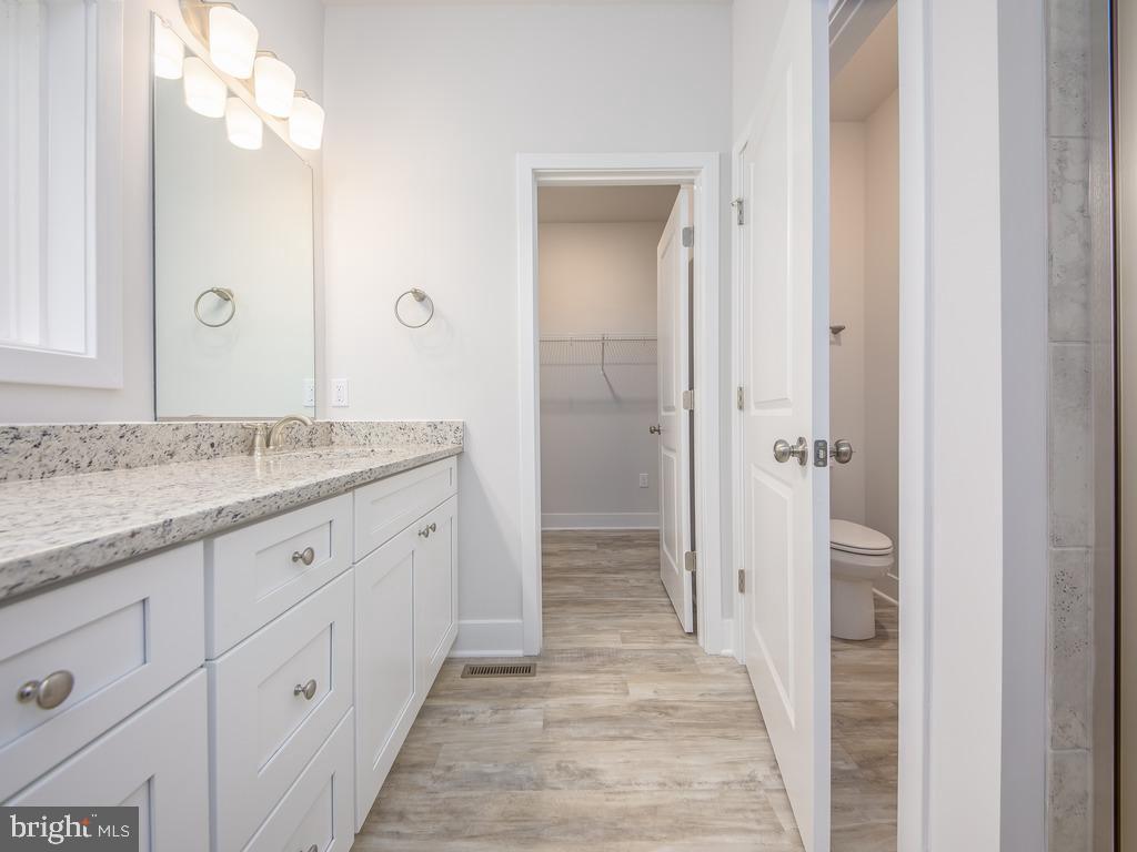 Tbd Lookout Circle Orange, VA 22960 - Photo 22 of 48 a spacious bathroom with a granite countertop sink mirror and a shower