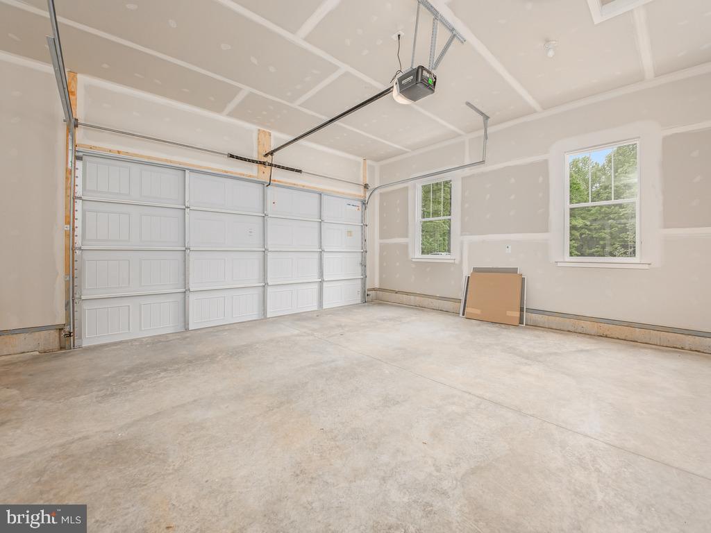 Tbd Lookout Circle Orange, VA 22960 - Photo 43 of 48 an empty room with windows and chandelier fan