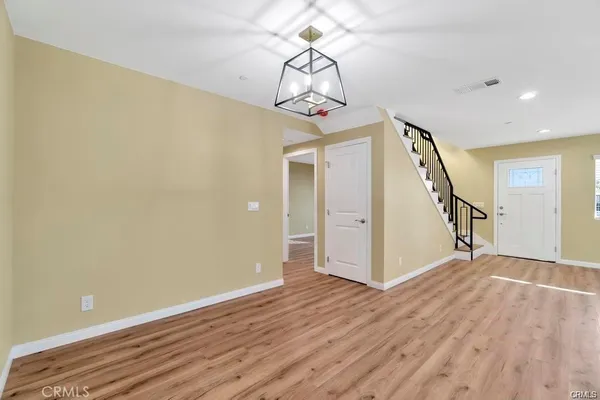 a kitchen with a sink a cabinets and appliances