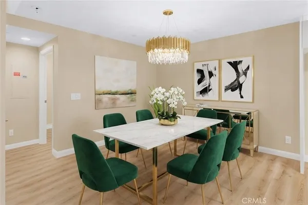 a view of a dining room with furniture and wooden floor