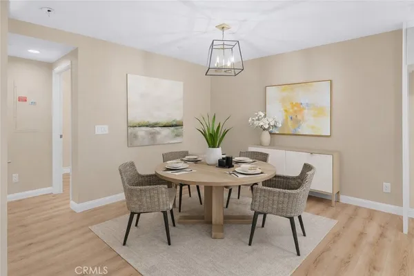 a kitchen with a table and chairs in it