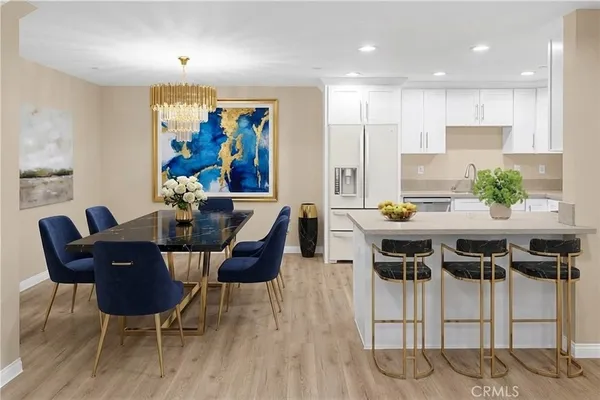 a dining room with furniture and wooden floor