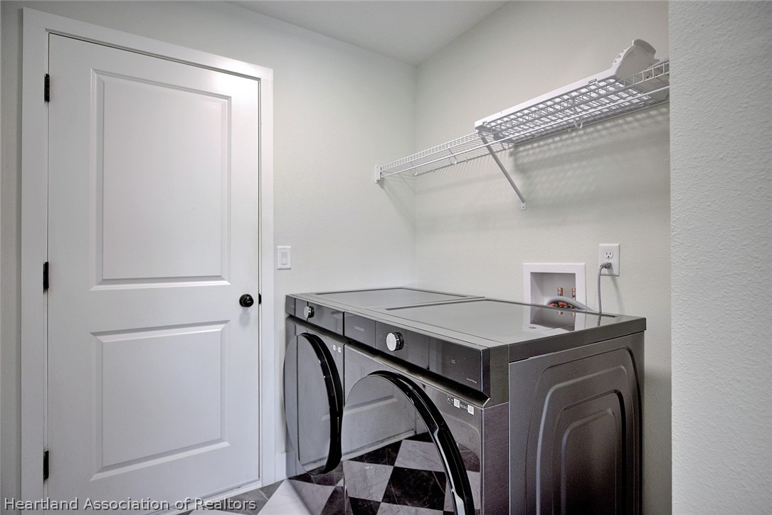 111 Vale Court Sebring, FL 33876 - Photo 16 of 40 a utility room with dryer and washer