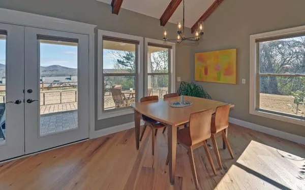 a view of a dining room with furniture window and outside view