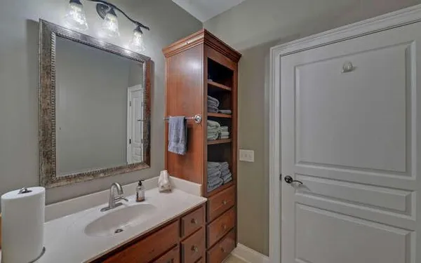 a bathroom with a double vanity sink and mirror