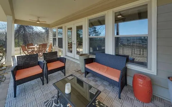 a outdoor living space with furniture and a potted plant