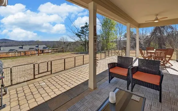 a view of a chairs and table on the terrace