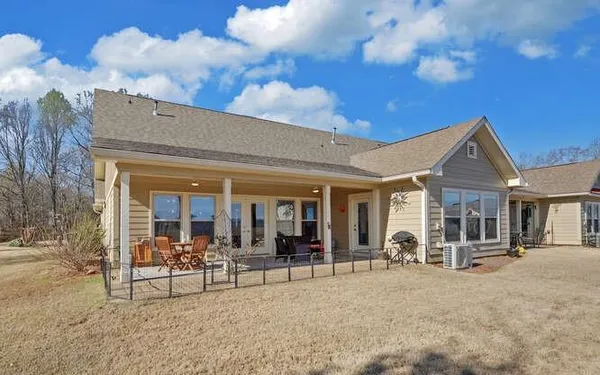 a view of a building with sitting area and roof