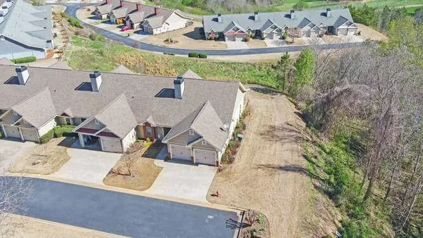an aerial view of a house with outdoor space