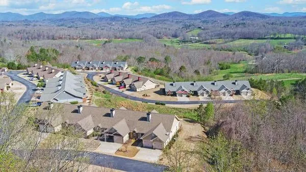 an aerial view of a house with a garden