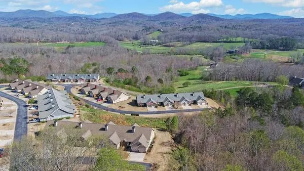 an aerial view of a house with outdoor space