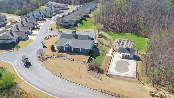 an aerial view of a house with a swimming pool
