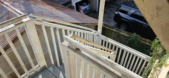 a view of balcony with wooden stairs
