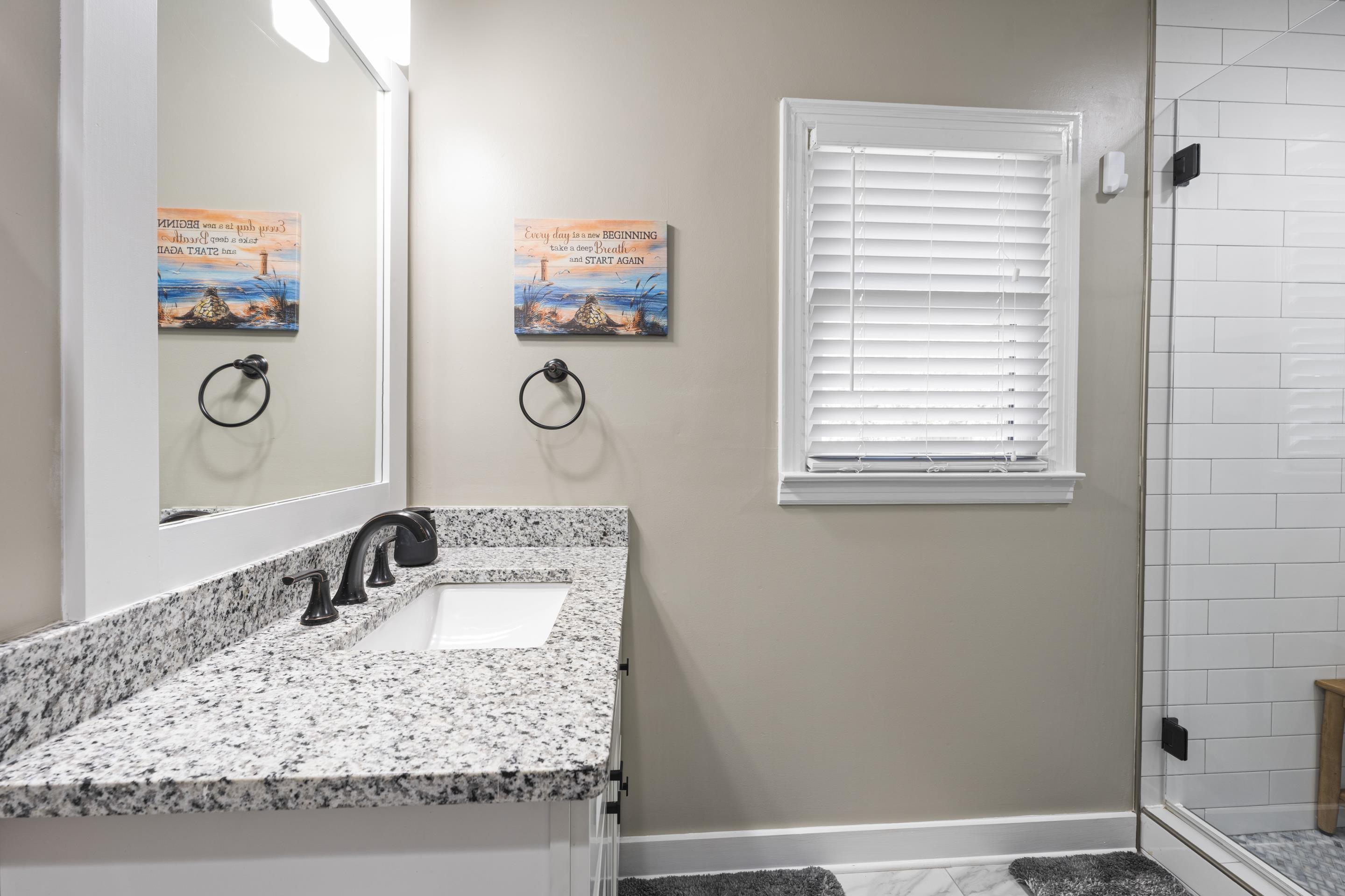 260 South Fenwick Road Memphis, TN 38111 - Photo 27 of 40 Bath 2 features a sleek vanity with granite countertops , modern fixtures and a spacious shower with subway tile and accents.